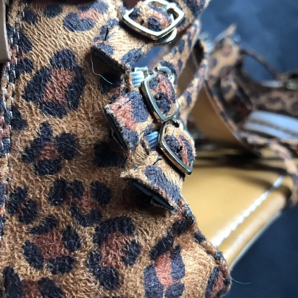 New never worn animal print buckle sandals. Side clasps . Zipper up the back.
